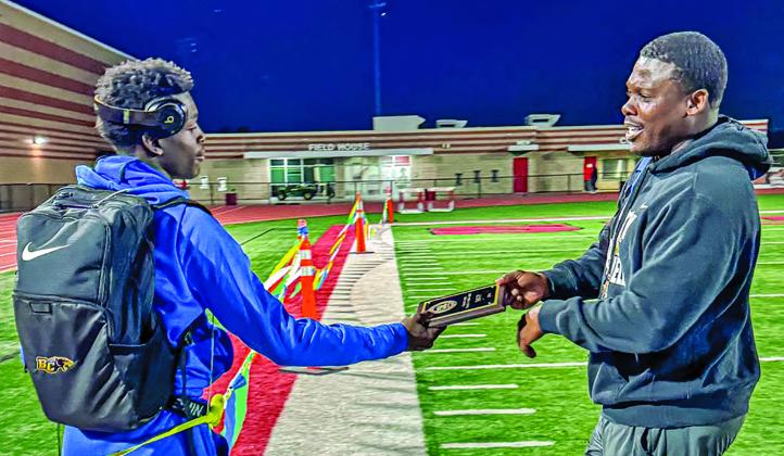 Contributed photo Blackcat trackster Xylan Williams, left, receives the MVP Award from Head Track Coach and Head Football Coach Robert Jones at the District track meet last week 