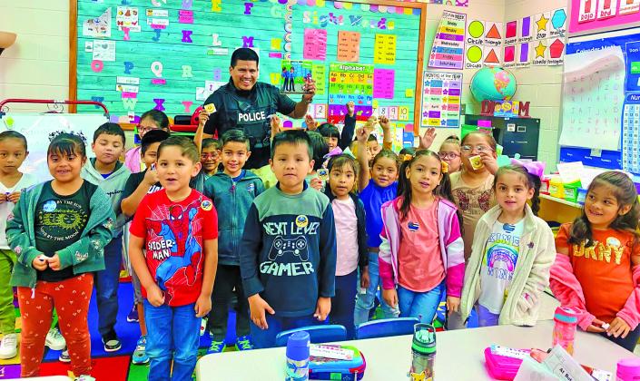 BCISD photo Bay City Police Officer A. Lopez read to Mr. DeLaRosa and Ms. Munoz's kindergarten classes at Cherry Elementary.
