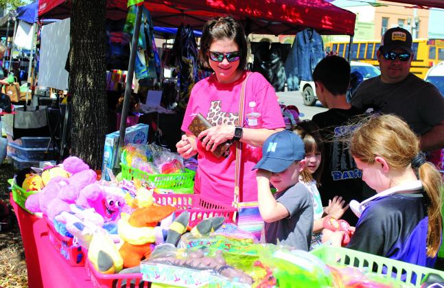 Sentinel photo/Jessica Shepard The return of Matagorda County Trade Days featured a variety of vendors sporting Easter trinkets and wares, Saturday, March 26. One vendor had a variety of toys for Easter basket filler that these youngsters picked through.