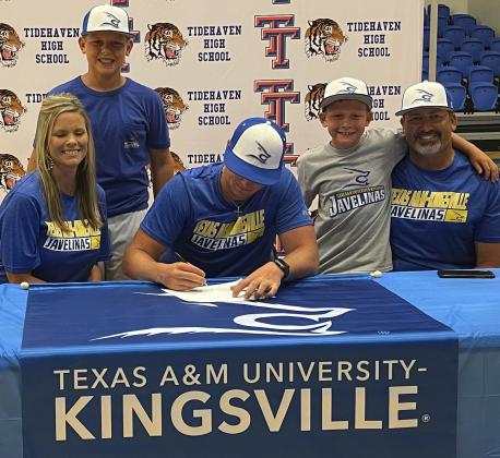 Courtesy photo Tidehaven standout Logan Crow is joined by his family in recently signing to play baseball at Texas A&M Kingsville. 