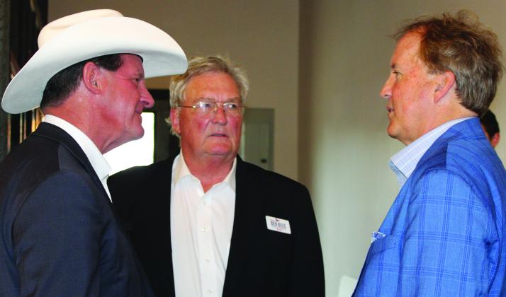 Sentinel Photo/Jessica Shepard  At left, Republican run-off candidate District 30 State Rep. AJ Louderback greets Attorney General Ken Paxton, right, at a support-fundraiser last week. Paxton arrived via plane with Republican run-off candidate District 12 State Rep. Ben Bius, center.